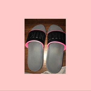 Pink Nike Slides.